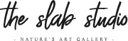 The image shows a logo with the text "the slab studio" in a cursive font, followed by the tagline "NATURE'S ART GALLERY" in all caps underneath.