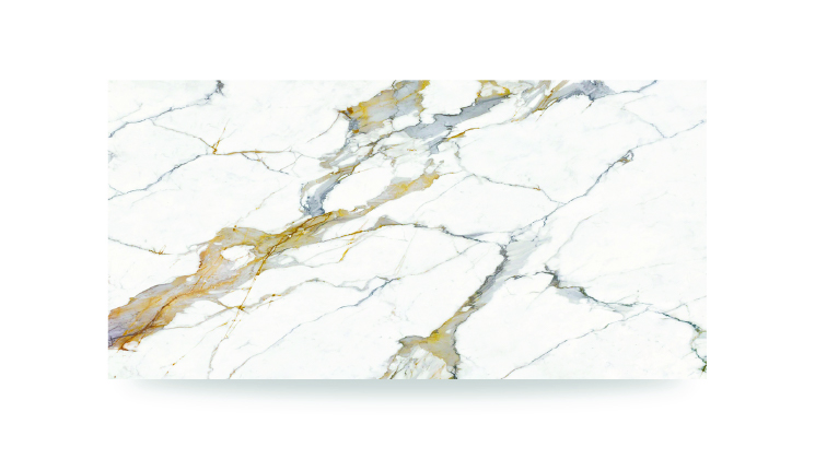 The image shows a white surface with dramatic gray and gold veining in an irregular pattern, resembling a polished marble or quartz countertop.