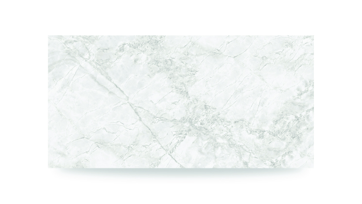 The image shows a white surface with soft, gray veining in an irregular pattern, featuring both bold and subtle lines, resembling a natural stone countertop.