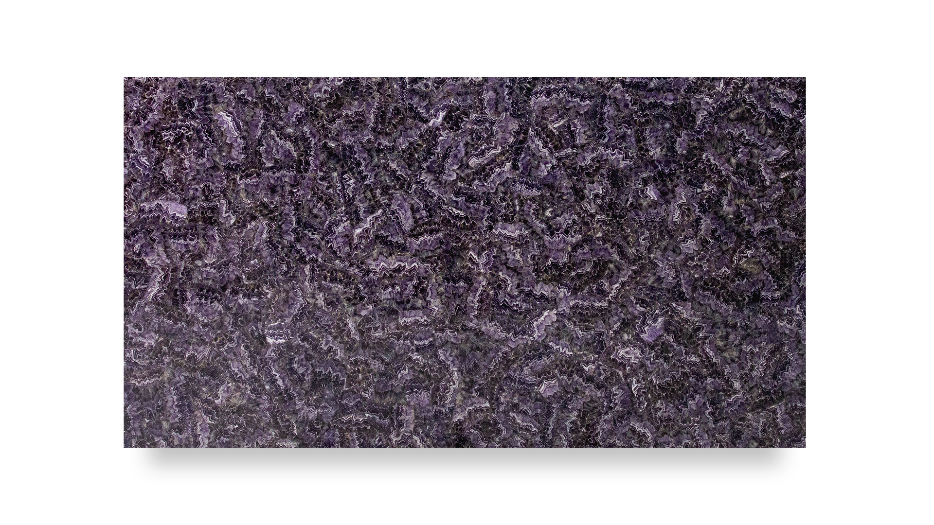 A slab of semi-precious amethyst with a rich, dark purple color, showcasing an intricate, wavy, and textured pattern throughout its surface.