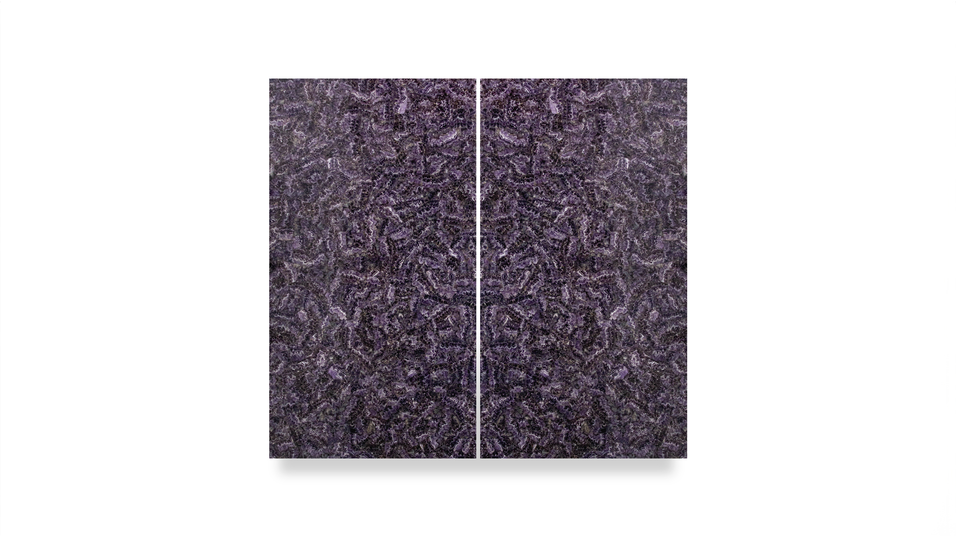 A semi-precious stone slab with a deep purple hue, displaying a symmetrical, intricate pattern that creates a textured and reflective surface.