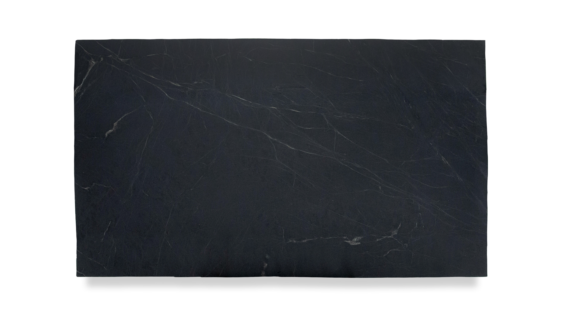 A slab of dark soapstone with subtle, thin white veining throughout, showcasing a smooth and consistent texture.