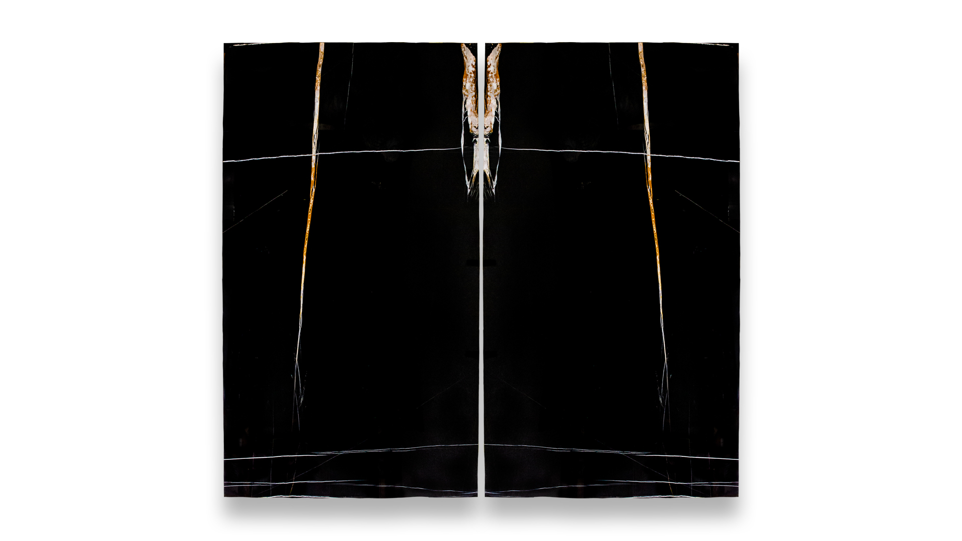 A set of two Sahara Noir marble slabs, arranged in a mirrored pattern, showcasing a black background with striking white and gold veining.