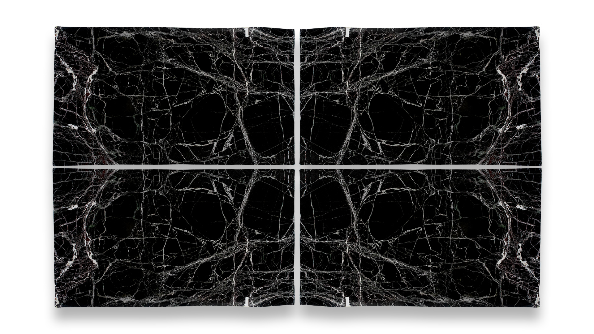 Four polished black marble slabs in a quad layout, featuring intricate white veining patterns creating a striking web-like design.