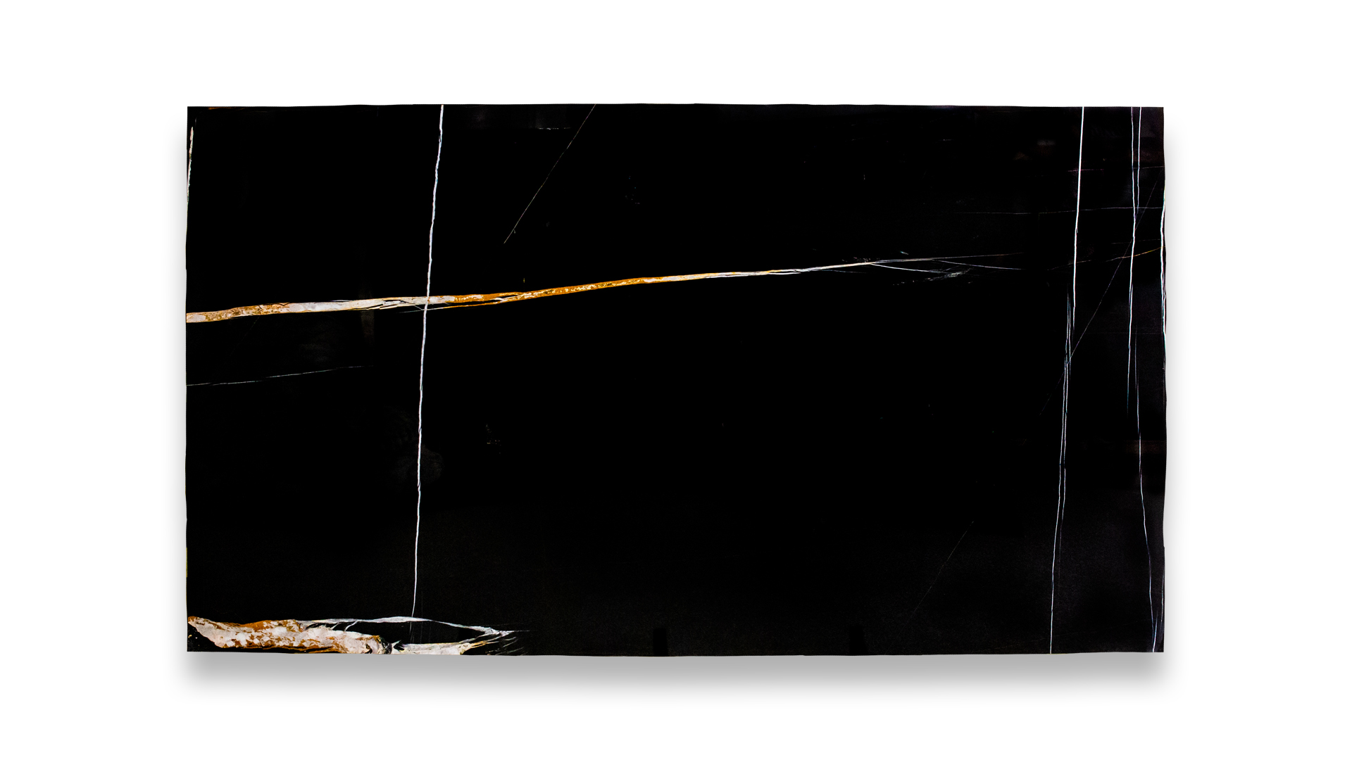 A single Sahara Noir marble slab with a polished finish, featuring a black background accented by striking white and gold veining.