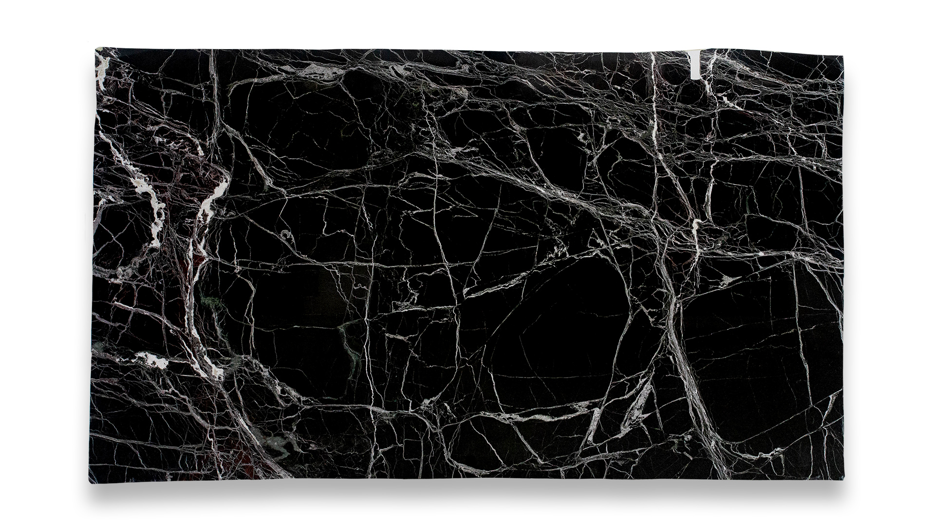 This image shows a Verde Levanto Polished Marble slab with a deep black background and prominent white veining, creating an intricate pattern.