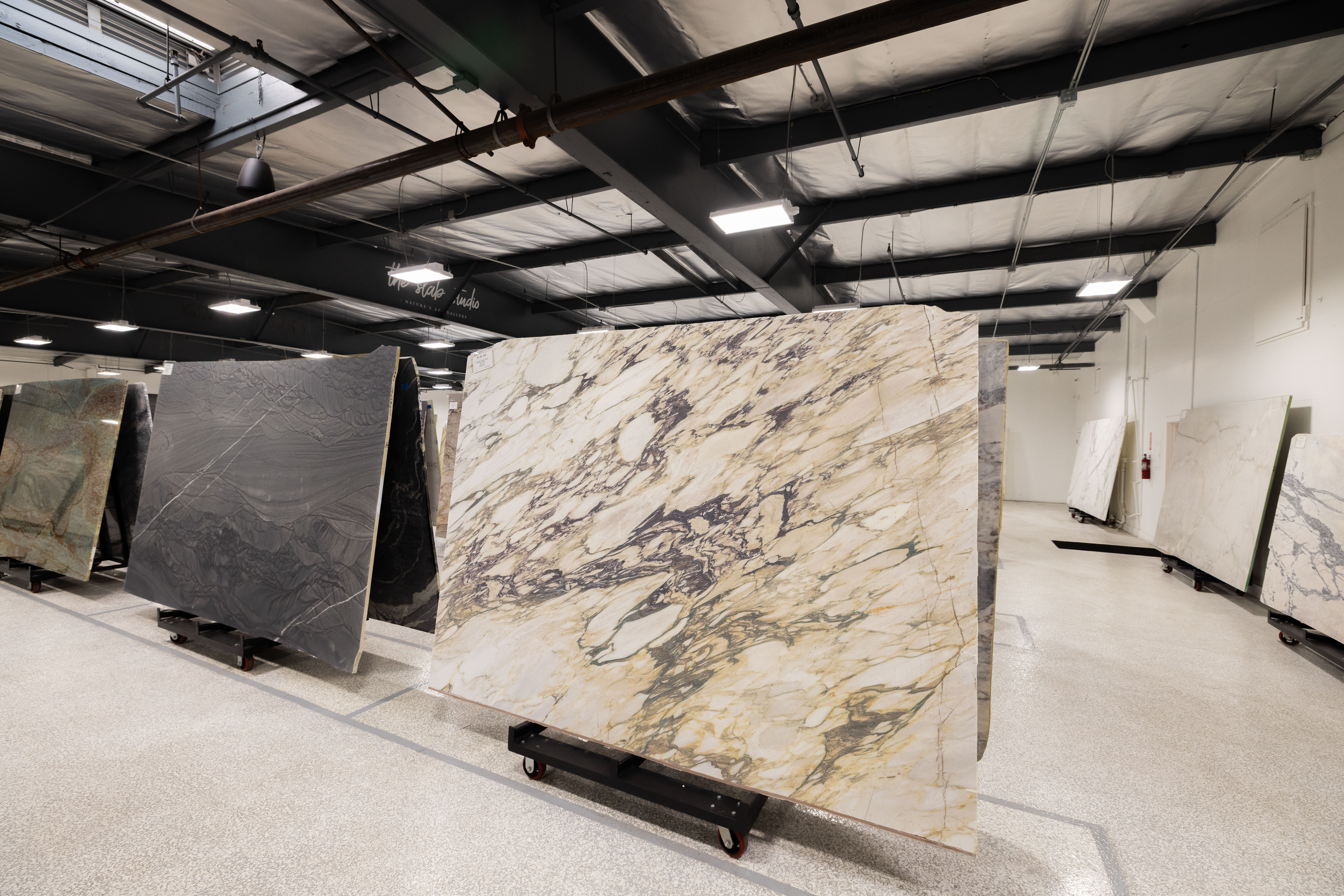 Premium Marble Slab at The Slab Studio Dramatic marble slab with bold natural veining displayed at The Slab Studio showroom in Santa Ana, California