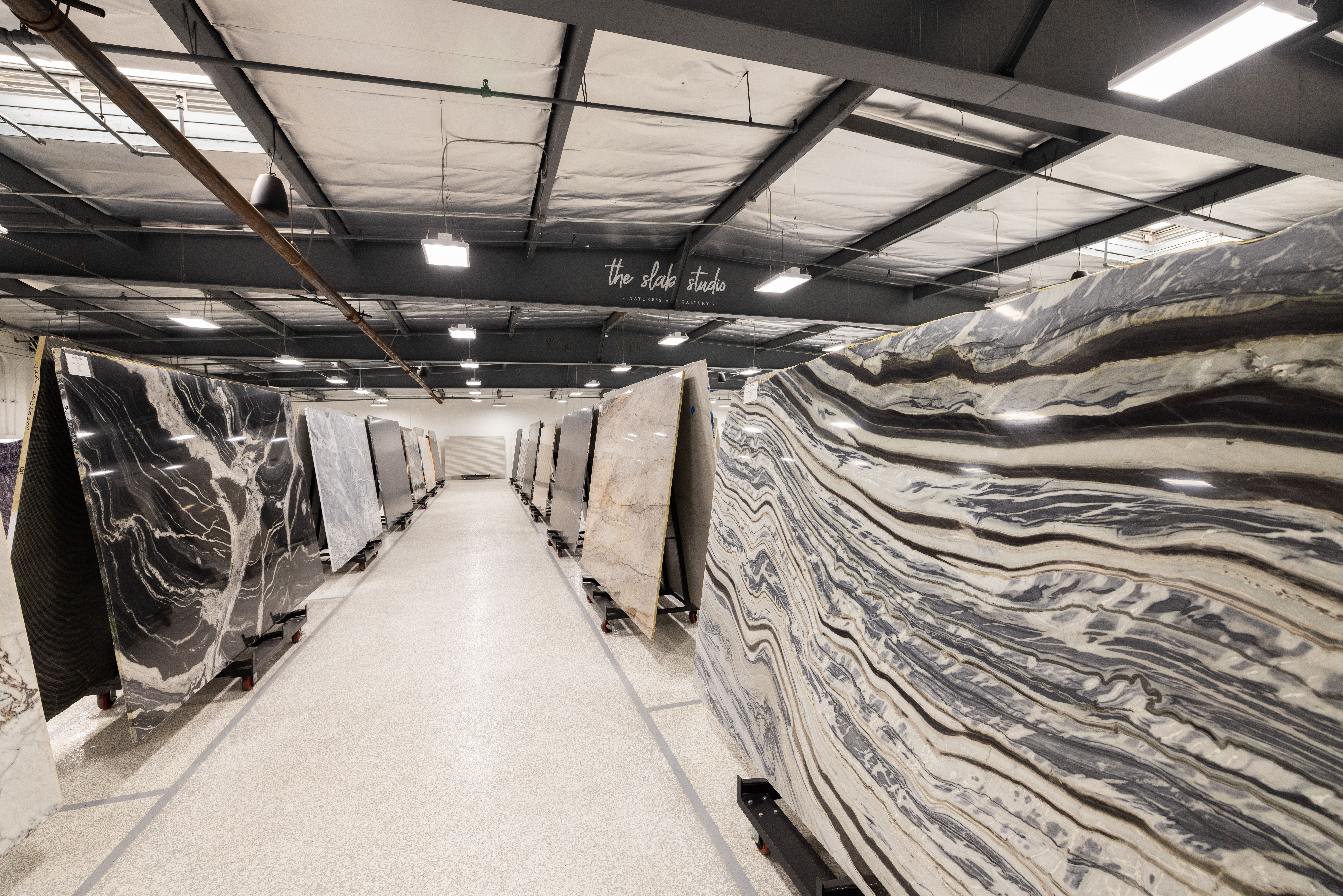 The Slab Studio Indoor Showroom Interior view of The Slab Studio's indoor natural stone slab showroom in Santa Ana, California.