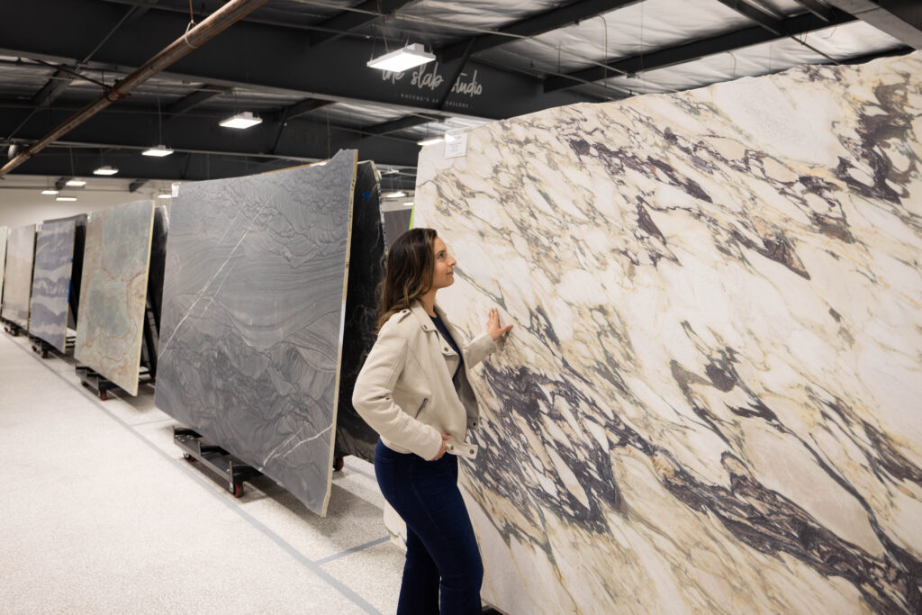 Dramatically veined natural stone slab displayed at The Slab Studio showroom in Santa Ana, California.
