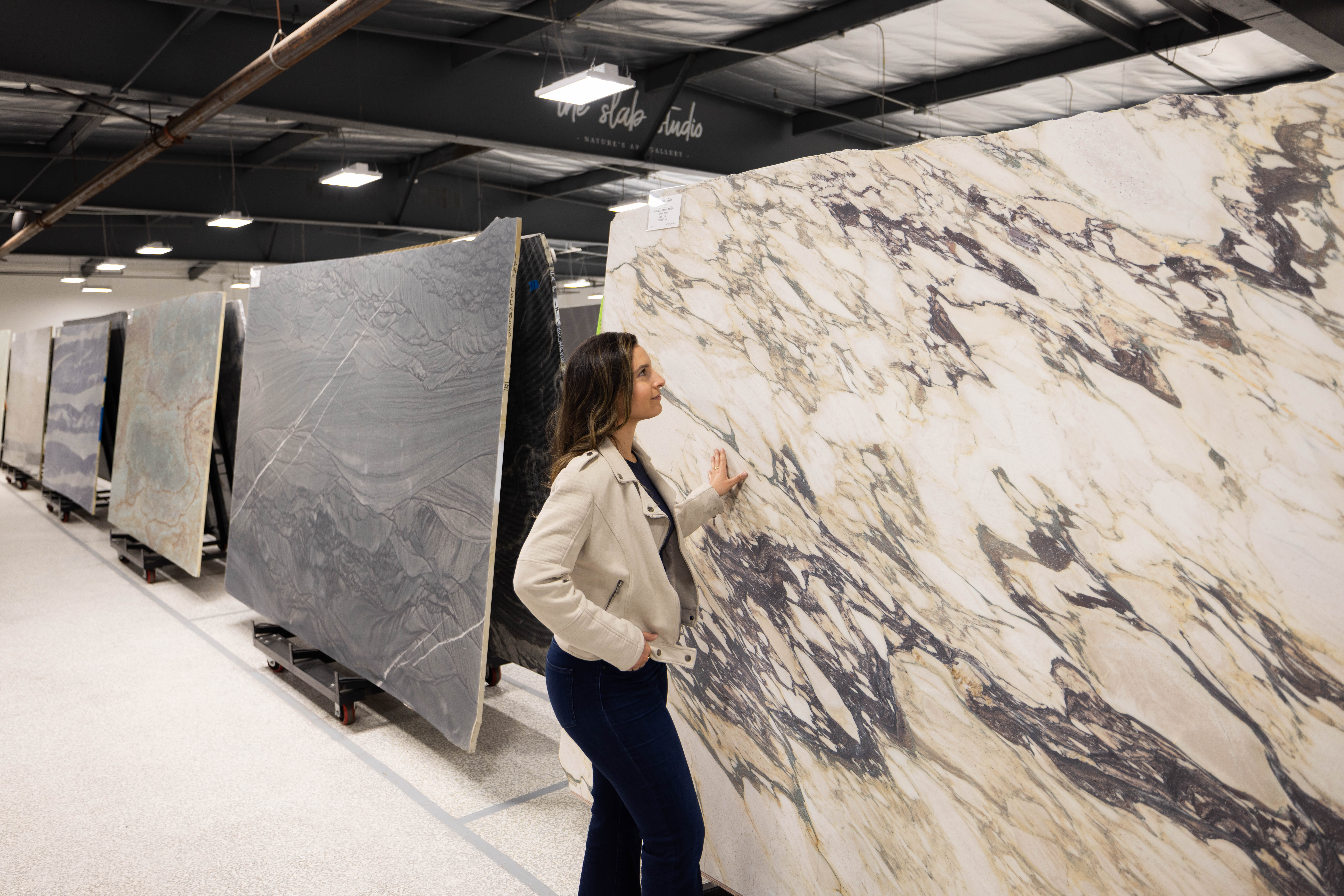 Dramatically veined natural stone slab displayed at The Slab Studio showroom in Santa Ana, California.