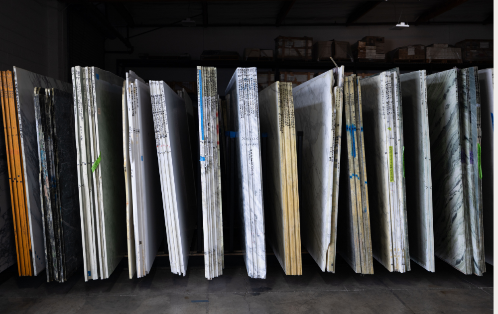 Sequential natural stone slabs organized by block position at The Slab Studio in Santa Ana for accurate book-matching and material selection.