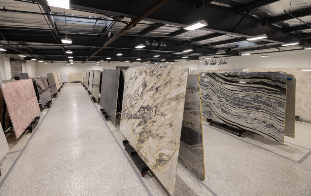 Premium Natural Stone Showroom at The Slab Studio in Santa Ana Wide view of The Slab Studio's indoor natural stone showroom featuring premium slab inventory organized for designers, architects, builders, and fabricators in Santa Ana.