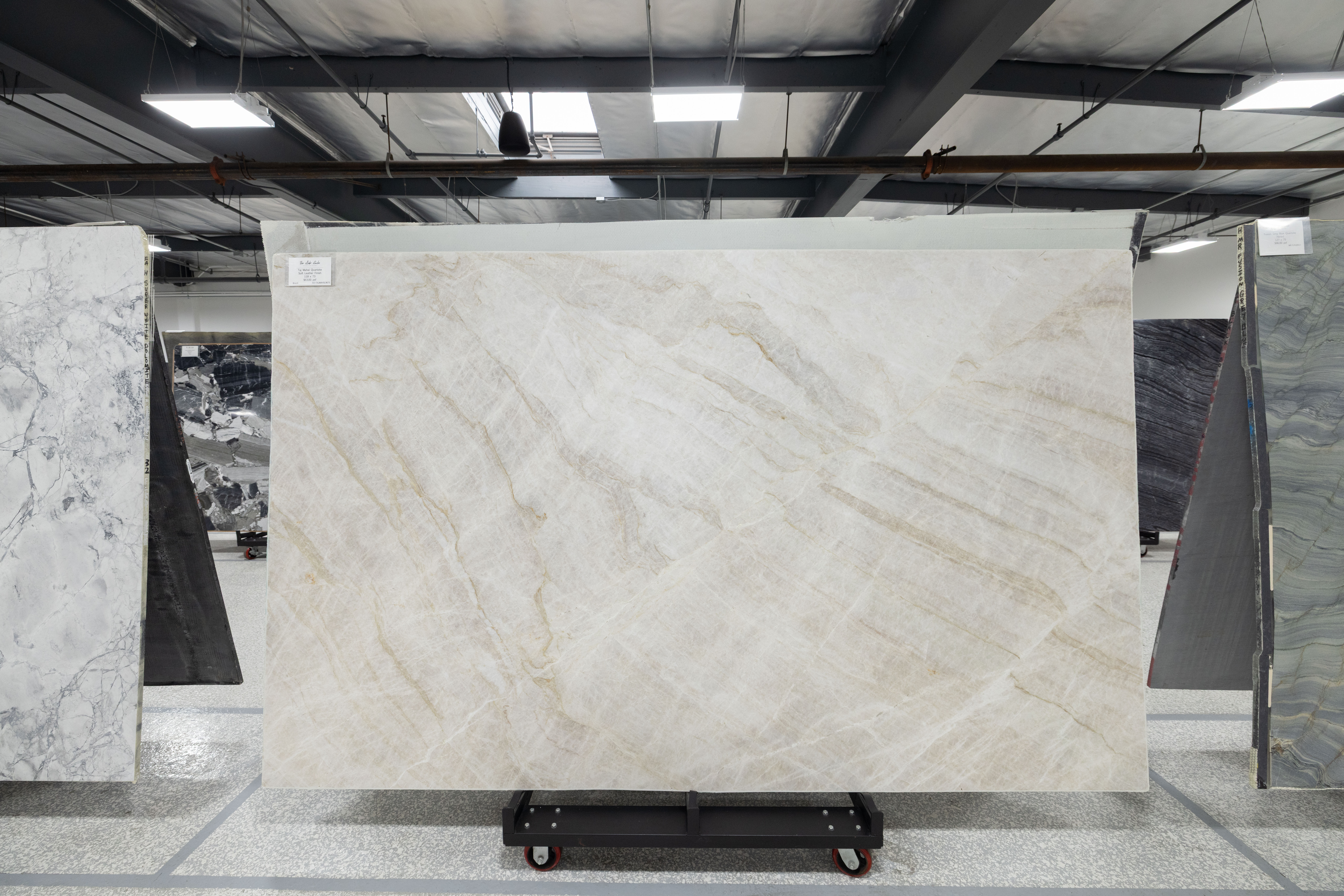 Warm-toned quartzite slab on display at The Slab Studio in Santa Ana
