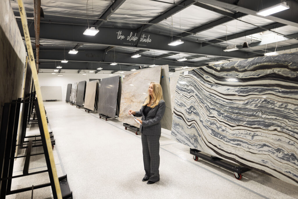 Jill Kummer evaluating slab inventory at The Slab Studio Santa Ana