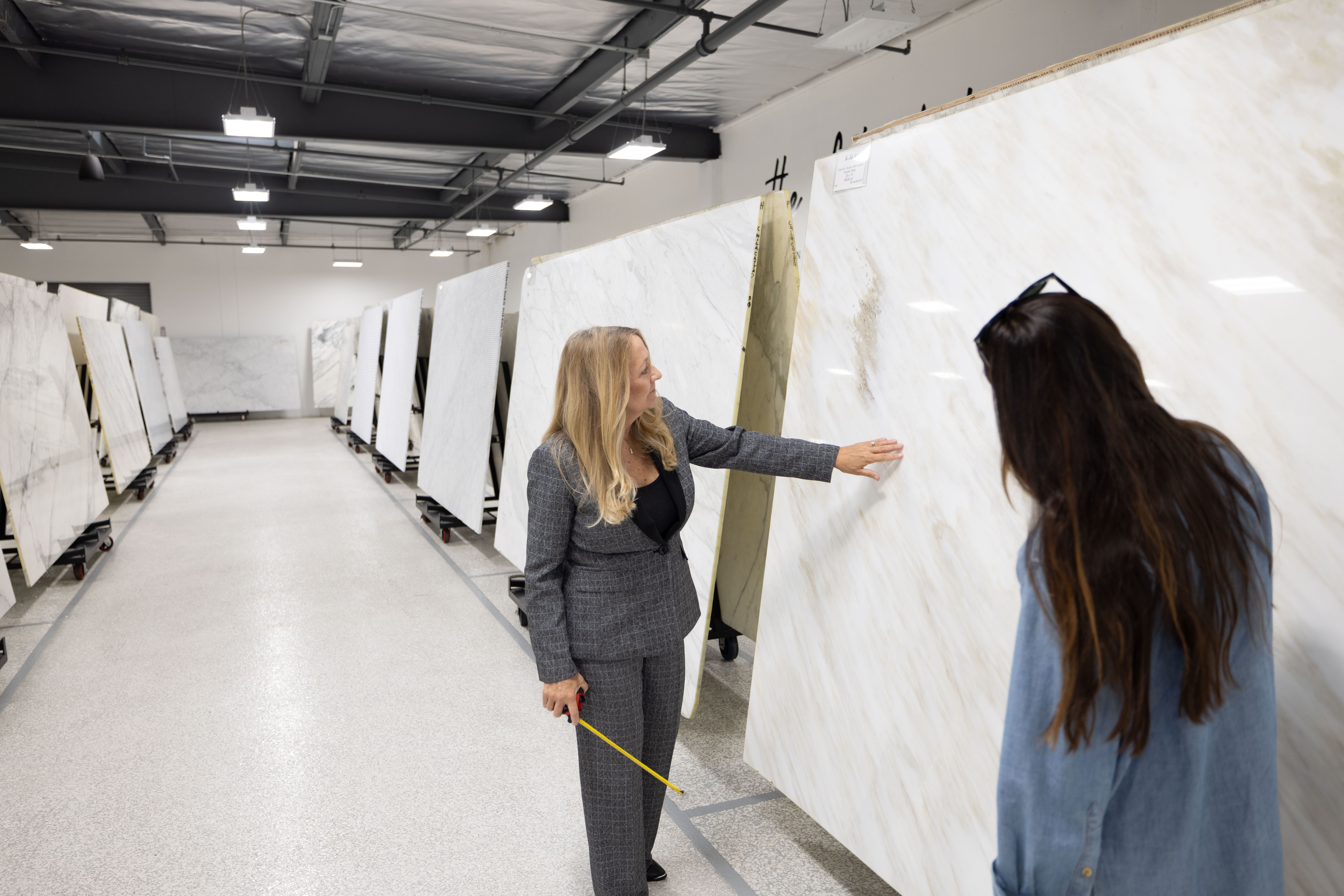 Jill Kummer Evaluating Natural Stone at The Slab Studio Jill Kummer evaluating a natural stone slab at The Slab Studio in Santa Ana