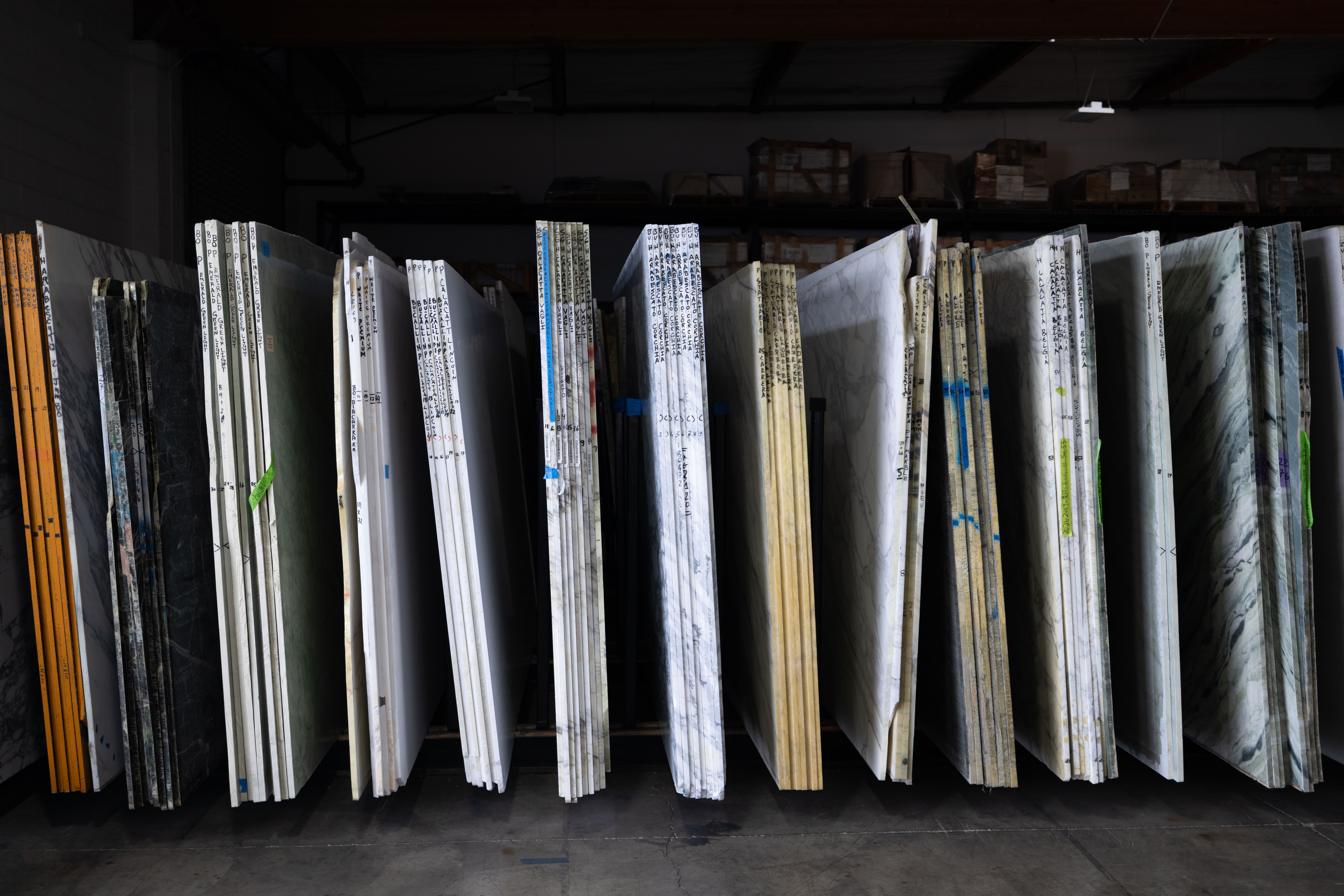 Labeled slab inventory at The Slab Studio warehouse in Santa Ana